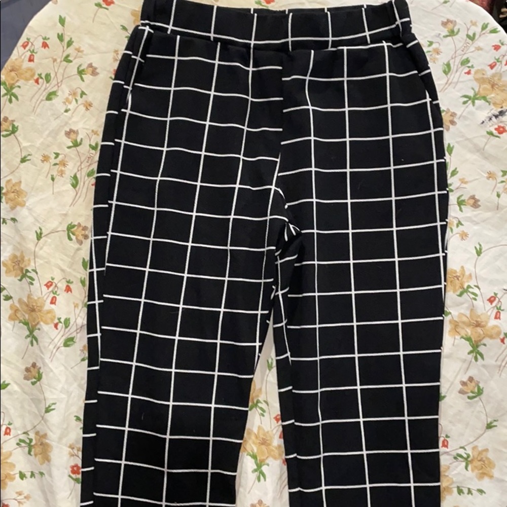 Black and white checkered-like patterned pants